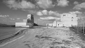Black and white image of historic buildings on the Trapani coast, Sicily.